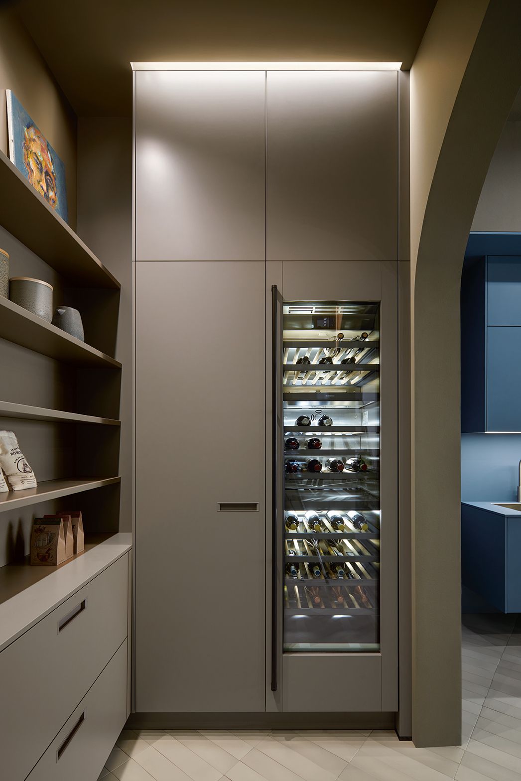 Handleless kitchen cabinets with wine cellar