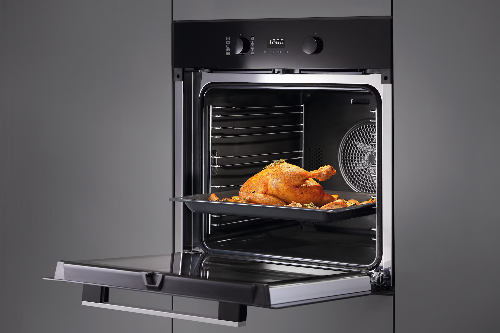 Miele Built In Oven Open with Cooked Chicken