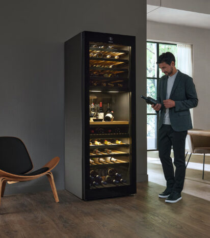 Tall Wine Unit with Man Checking Wine