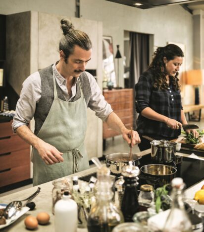 Two People Cooking on Induction Hob